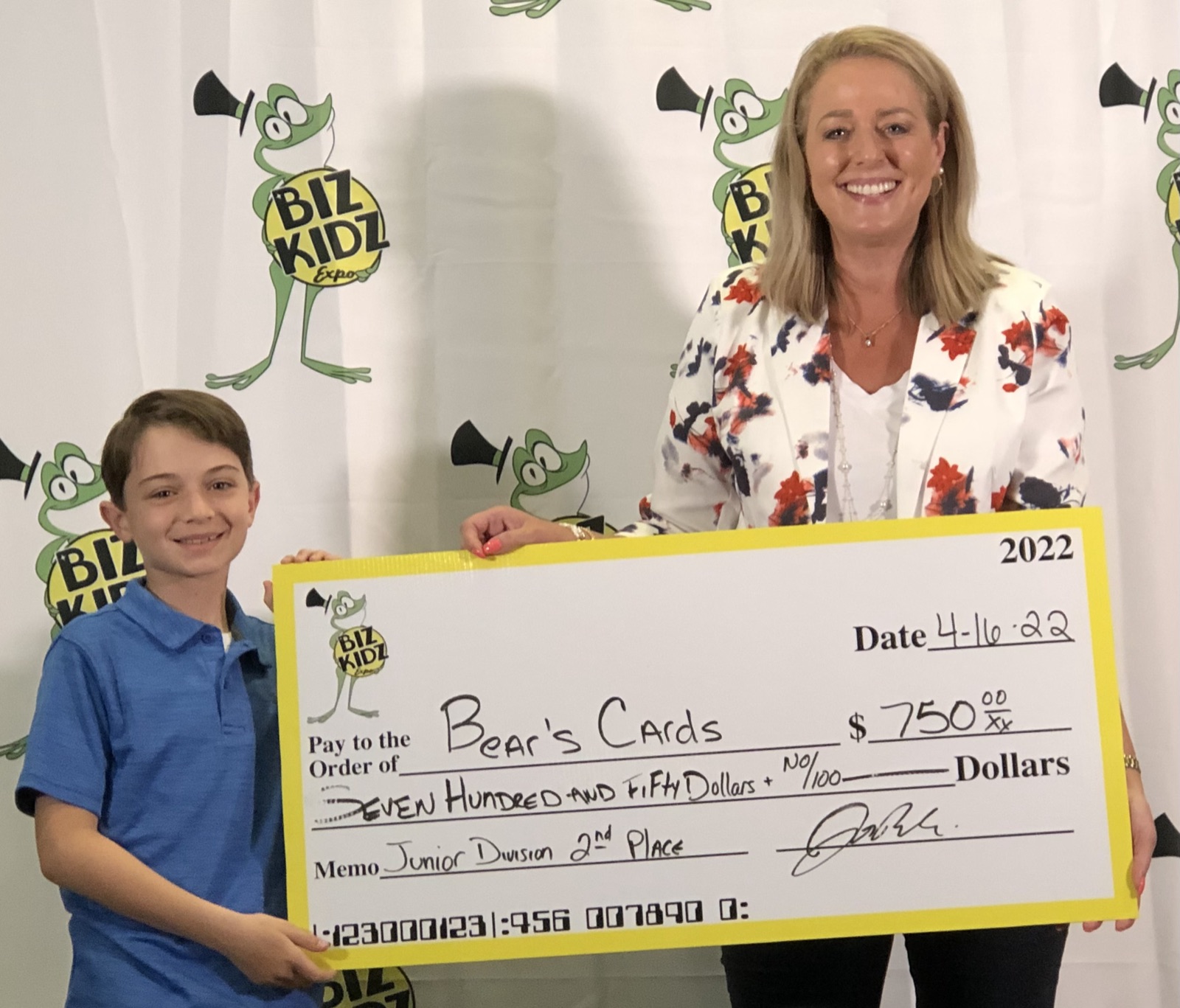 Ben Carpel is awarded $750 at the Biz Kidz Expo for his Cards for Kidz business!